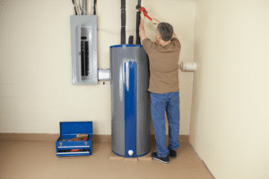 man working on a water heater