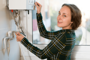 woman holding a water heater